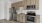 Kitchen with cabinets, white brick backsplash, and stainless steel