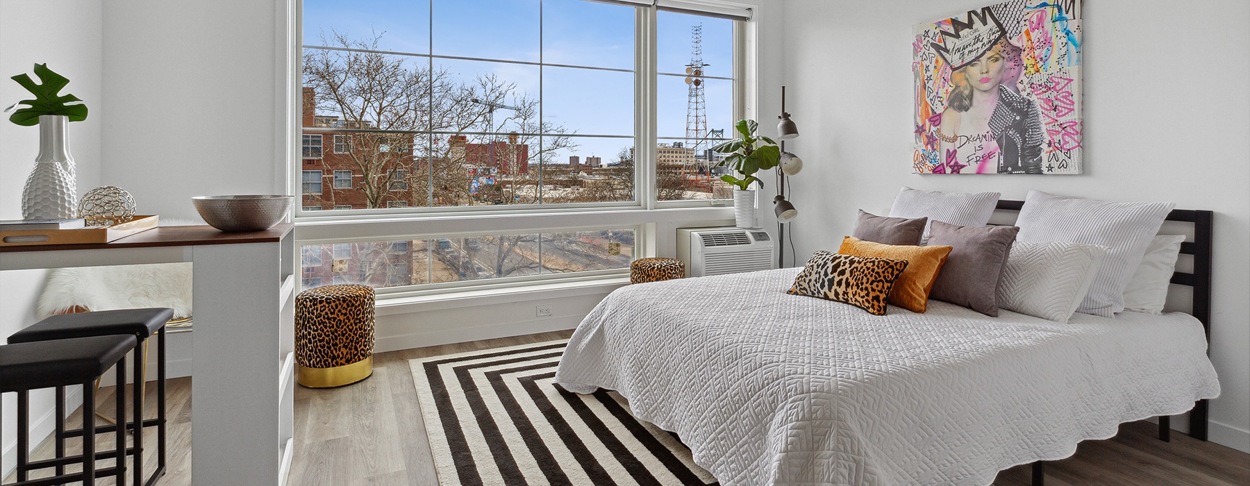 Spacious bedroom with popart and a great view